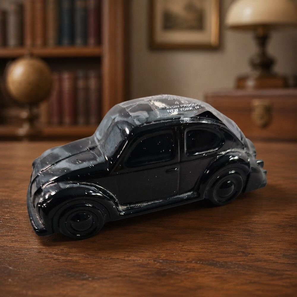 Vintage Avon Volkswagen Beetle aftershave decanter bottle in black glass.